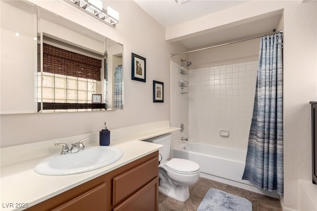 full bathroom with tile patterned flooring, shower / bath combo with shower curtain, vanity, and toilet