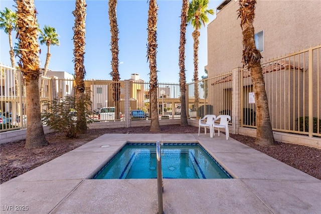 view of pool with a community hot tub