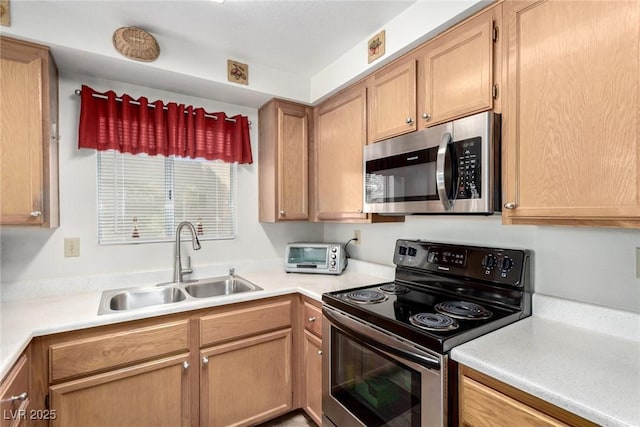 kitchen with sink and appliances with stainless steel finishes