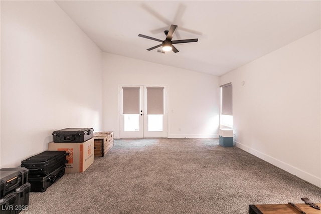 carpeted empty room featuring lofted ceiling, french doors, and ceiling fan