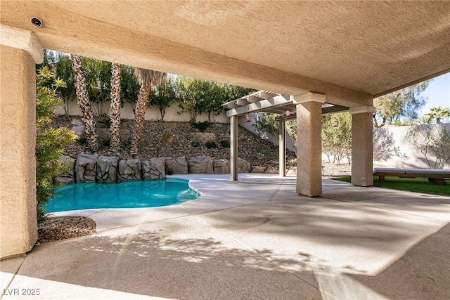 view of swimming pool featuring a pergola and a patio