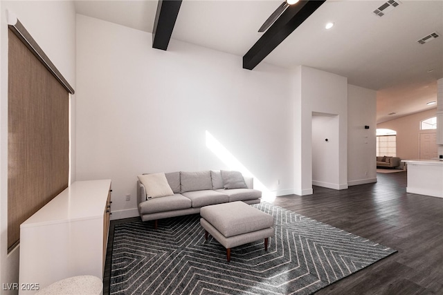 living room featuring beam ceiling, dark wood-type flooring, and ceiling fan