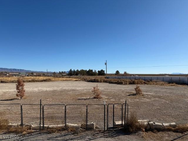 view of yard with a rural view