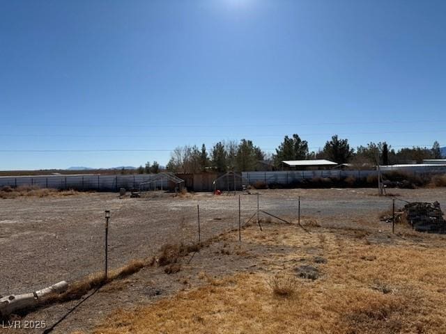 view of yard with a rural view