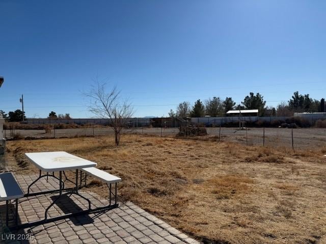 view of yard with a patio area and a rural view