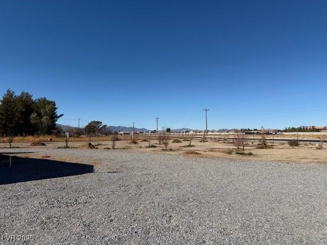 view of yard with a rural view