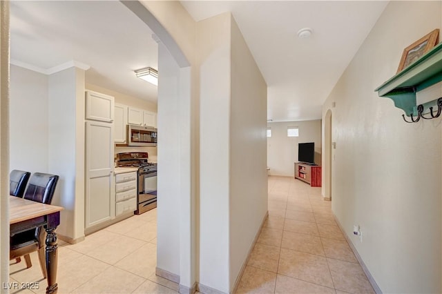 hallway with light tile patterned floors