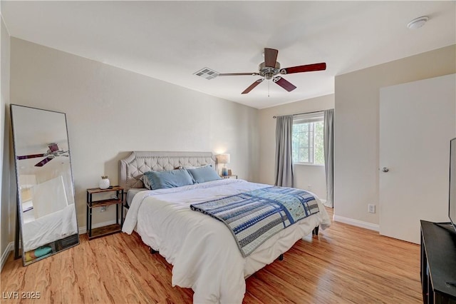 bedroom with ceiling fan and light hardwood / wood-style floors