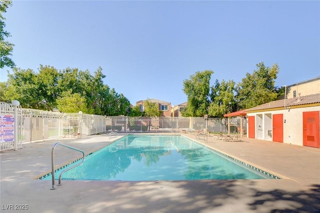 view of swimming pool with a patio