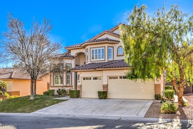 mediterranean / spanish-style house featuring a garage