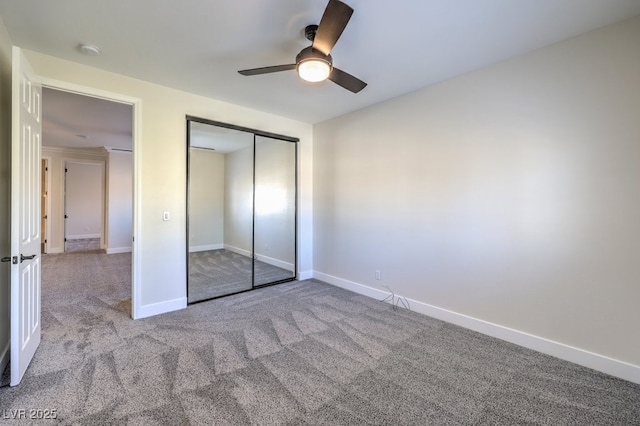 unfurnished bedroom with light colored carpet, a closet, and ceiling fan