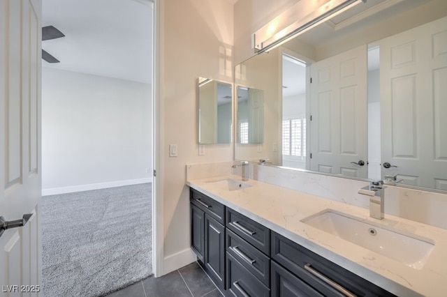 bathroom with tile patterned floors and vanity