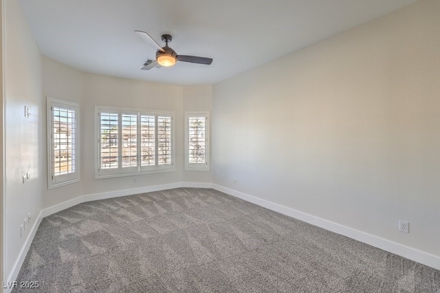 unfurnished room featuring ceiling fan and carpet