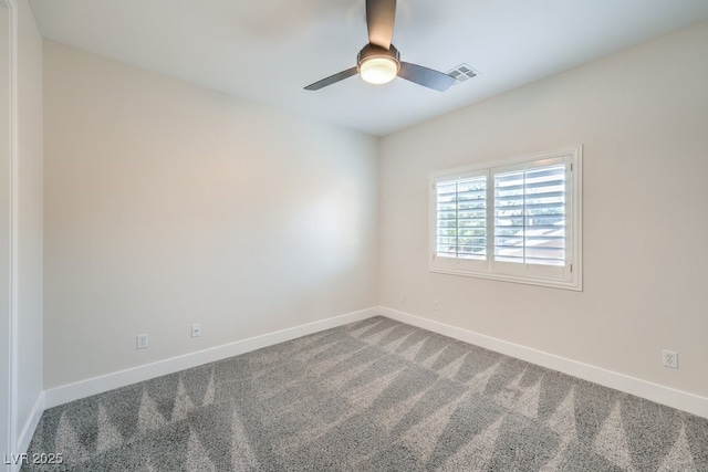 carpeted empty room with ceiling fan