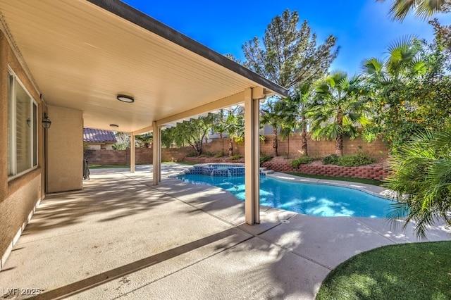 view of pool featuring an in ground hot tub and a patio