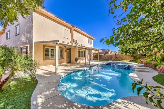 view of swimming pool with a patio area and an in ground hot tub