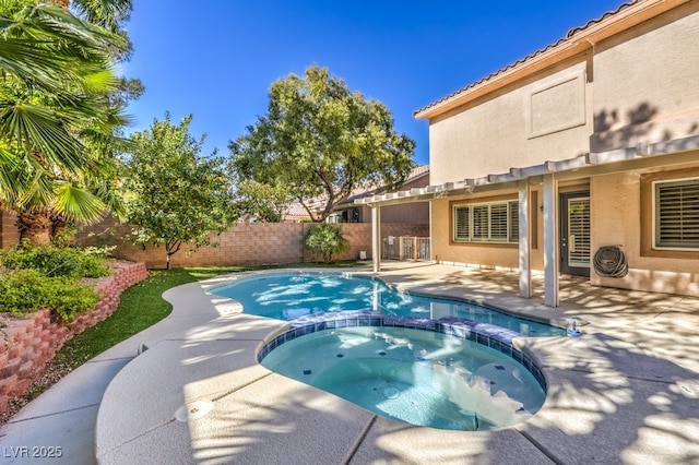 view of swimming pool with an in ground hot tub and a patio