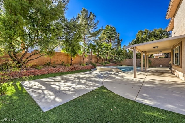 view of patio with a swimming pool with hot tub