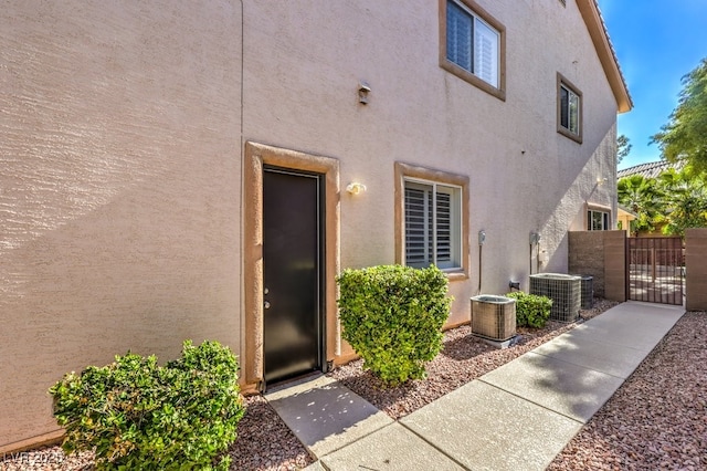 entrance to property featuring central AC