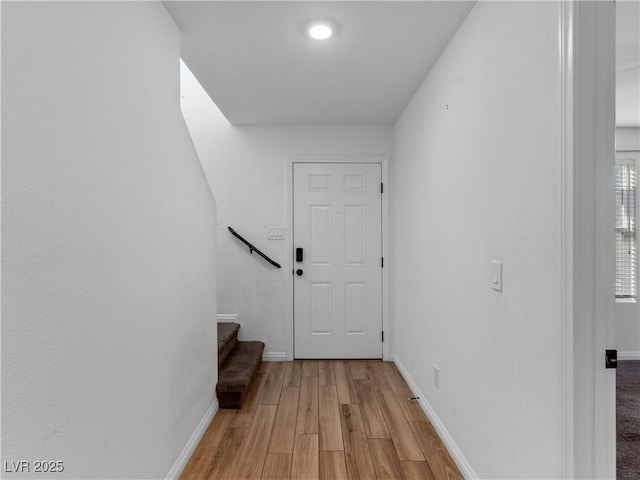 corridor featuring light hardwood / wood-style floors