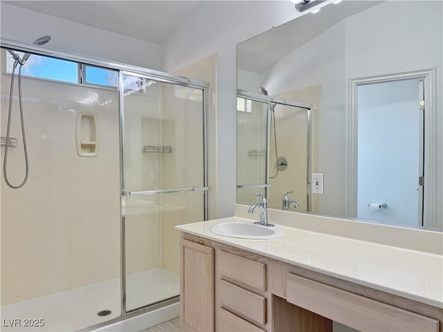 bathroom with vanity and an enclosed shower