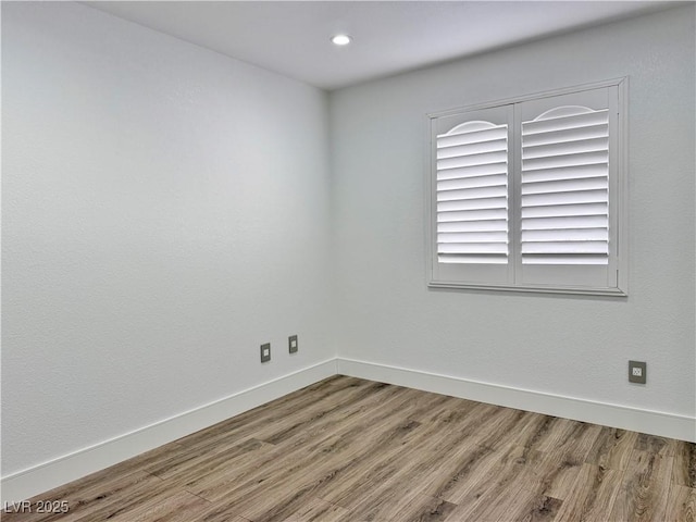 empty room with wood-type flooring