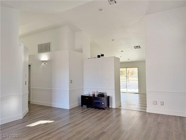 unfurnished living room featuring hardwood / wood-style floors