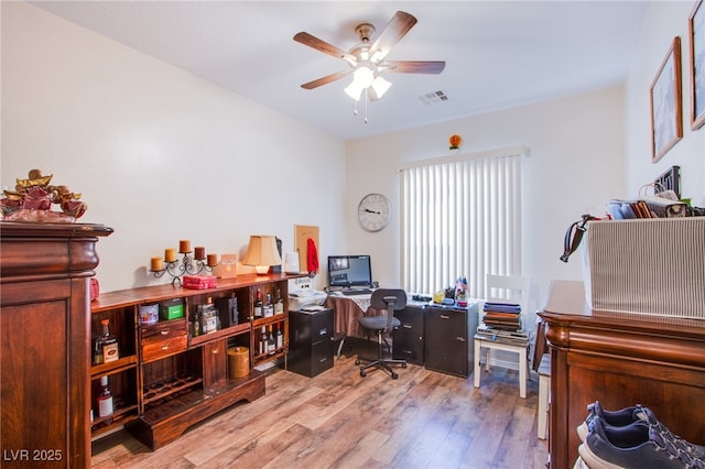 office featuring hardwood / wood-style floors and ceiling fan