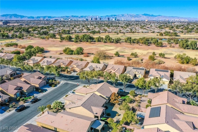 birds eye view of property with a mountain view