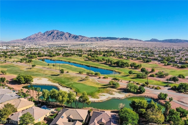 aerial view featuring a water and mountain view