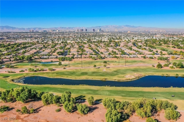 drone / aerial view featuring a water and mountain view