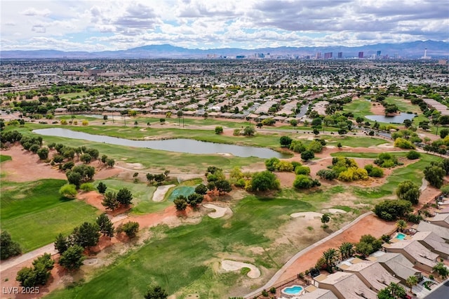 birds eye view of property featuring a water and mountain view