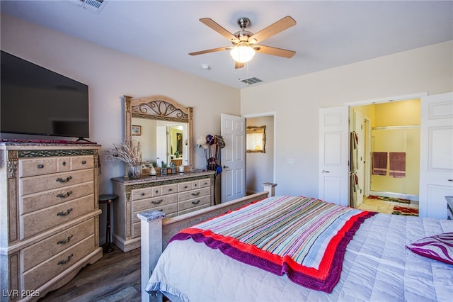 bedroom with dark wood-type flooring and ceiling fan