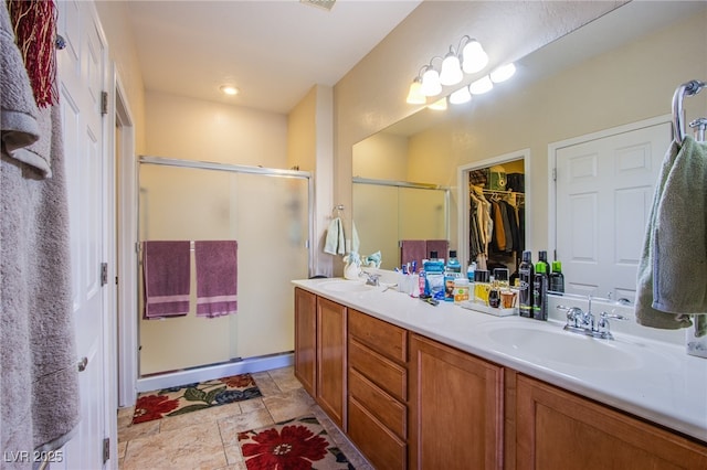 bathroom with vanity and an enclosed shower