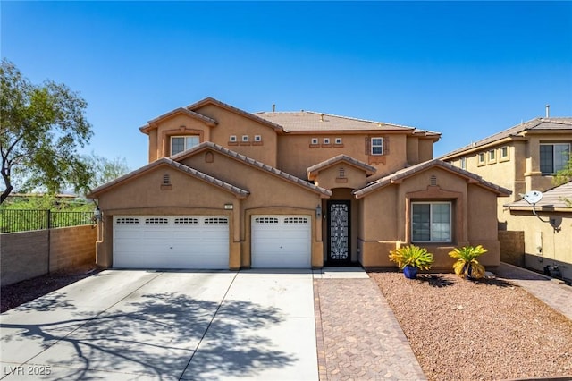 view of front of home with a garage