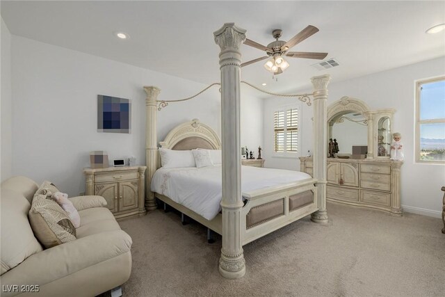 bedroom with ceiling fan and light colored carpet