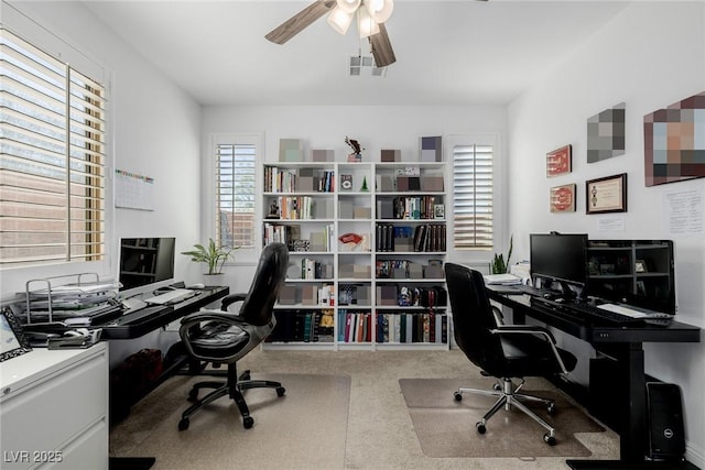 office with ceiling fan and carpet floors