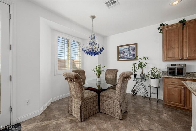 dining room featuring a chandelier