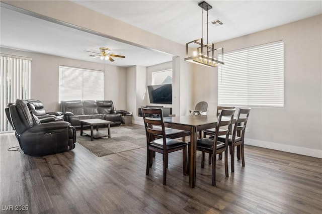 dining room featuring ceiling fan and dark hardwood / wood-style flooring