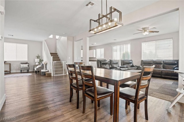 dining room featuring dark hardwood / wood-style flooring and ceiling fan