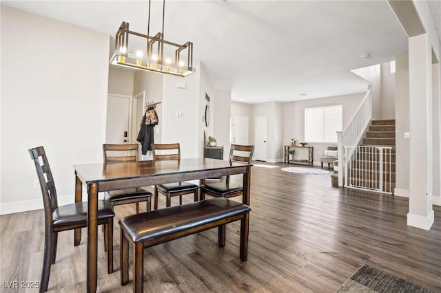 dining room with dark hardwood / wood-style flooring