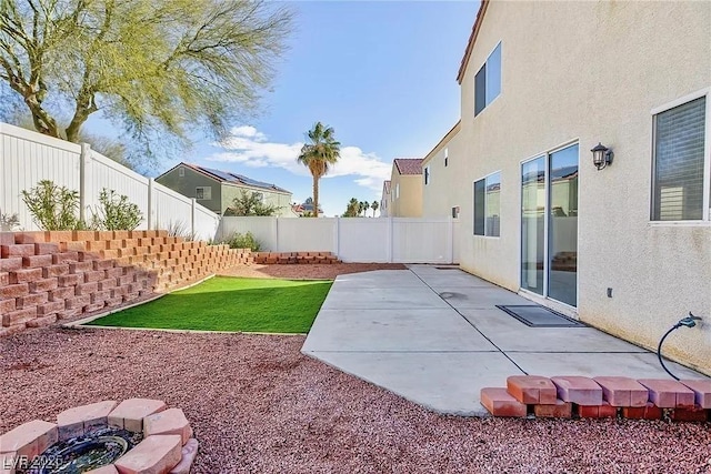 view of yard with an outdoor fire pit and a patio