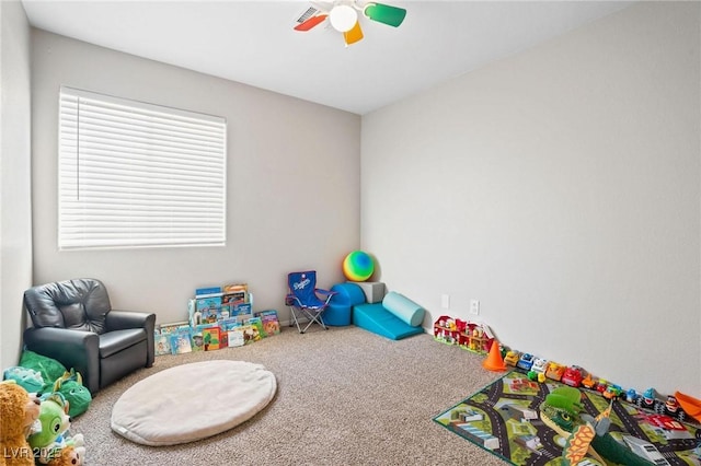 playroom with carpet and ceiling fan