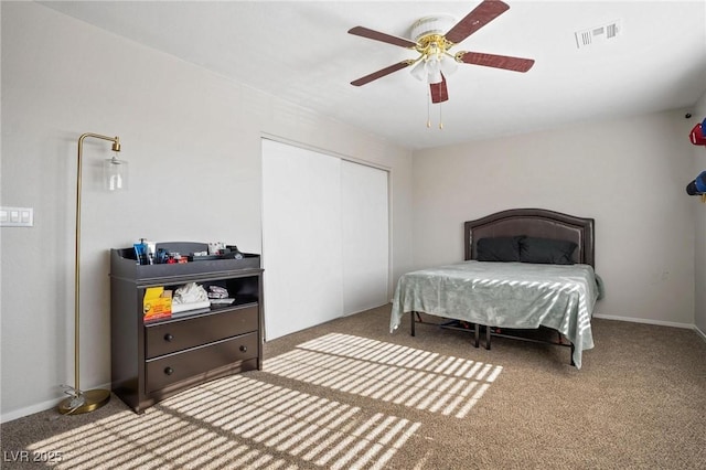 bedroom featuring ceiling fan, carpet floors, and a closet