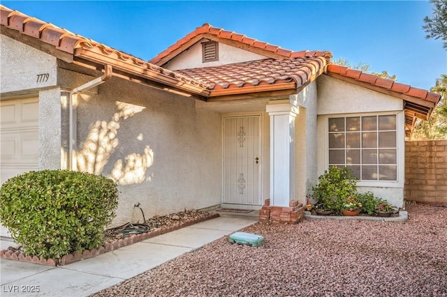 view of exterior entry featuring a garage