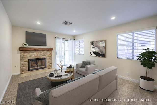 carpeted living room with a fireplace