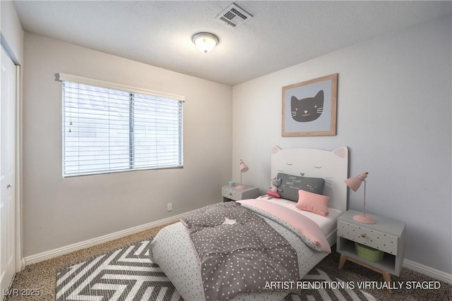 bedroom featuring carpet floors and a textured ceiling