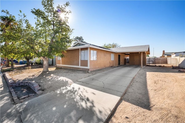 ranch-style home with a carport