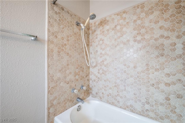 bathroom with shower / tub combination