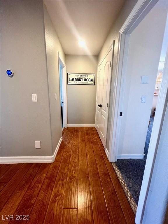 hallway with hardwood / wood-style flooring